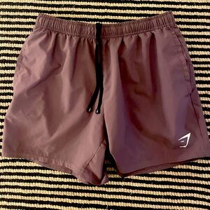 Purple Gymshark 5” shorts. Adult medium
